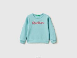 aqua Benetton barn genser i økologisk bomull med glitrende trykk 20TRB5626
